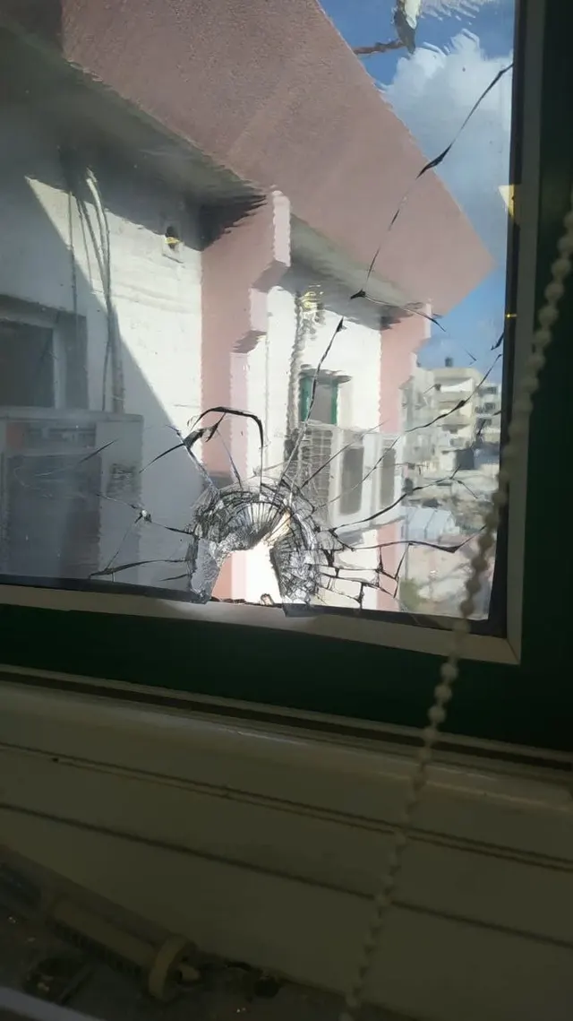 A bullet hits the window of the nursery ward inside Nasser Medical Complex west of Khan Younis.