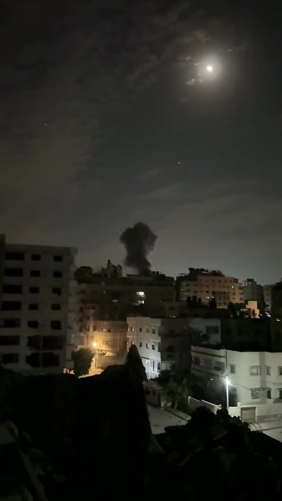 Fire broke out and thick smoke rose following the targeting of an apartment in the vicinity of Al-Mu'assasat Street west of Gaza City.