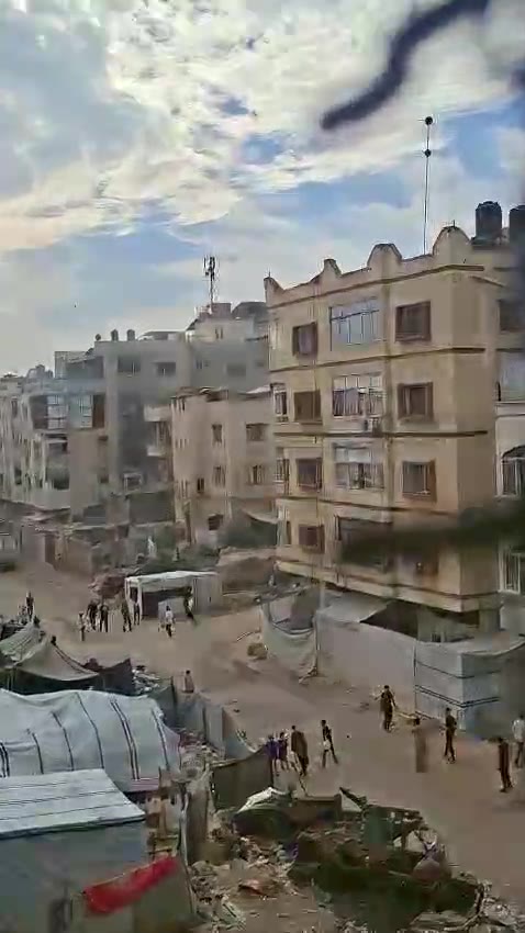 The moment a tent on the roof of a house belonging to the Ramlaoui family was struck near Al-Ma'mounia School in Al-Nasr neighborhood, west of Gaza City.