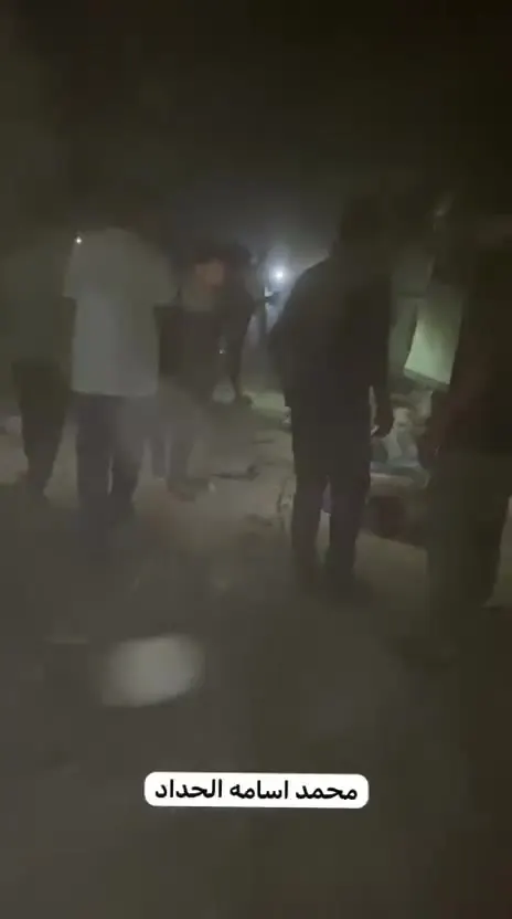 أثناء نقل الشهداء والجرحى من مكان القصف بحي الصبرة بمدينة غزة.